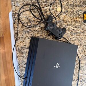 Sony PlayStation 4 Pro Console with DualShock Controller - Black